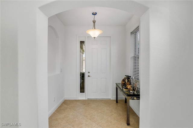 foyer entrance with light tile patterned floors