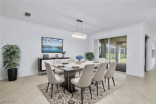 dining room featuring ornamental molding and light tile patterned floors