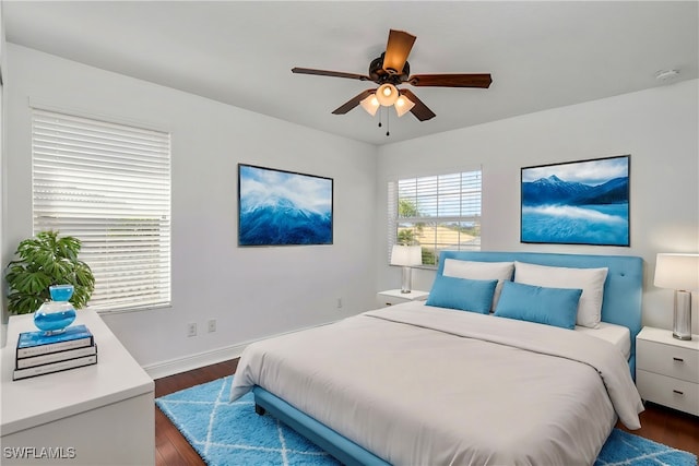 bedroom featuring ceiling fan and dark hardwood / wood-style flooring