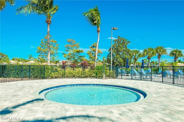 view of swimming pool featuring a patio area