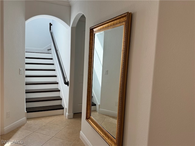 staircase featuring tile patterned floors