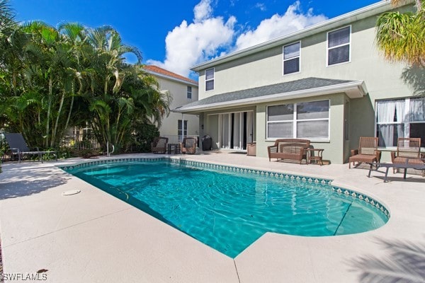 view of pool featuring a patio