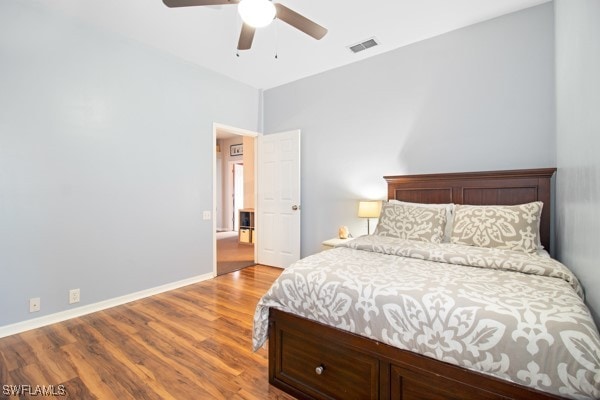 bedroom with light hardwood / wood-style floors and ceiling fan