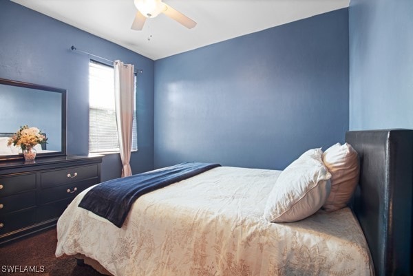 bedroom with ceiling fan and carpet floors