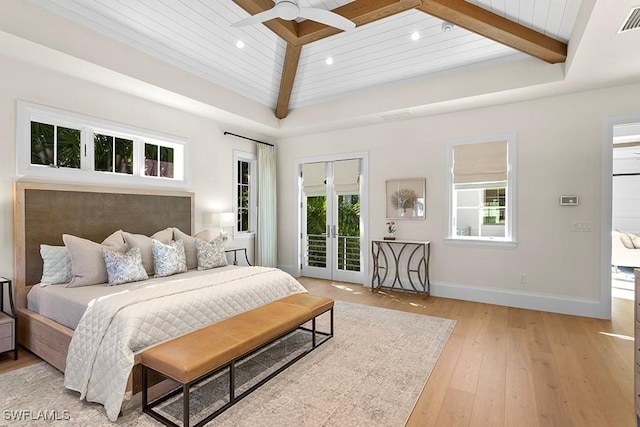 bedroom featuring access to exterior, multiple windows, light wood finished floors, beam ceiling, and recessed lighting
