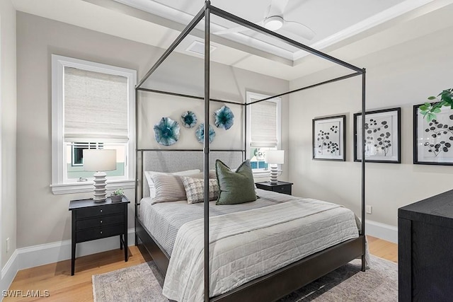 bedroom with wood finished floors and baseboards