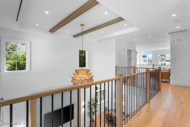 hallway featuring light wood-style floors, beam ceiling, recessed lighting, wood ceiling, and baseboards
