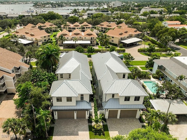 aerial perspective of suburban area featuring a pool area