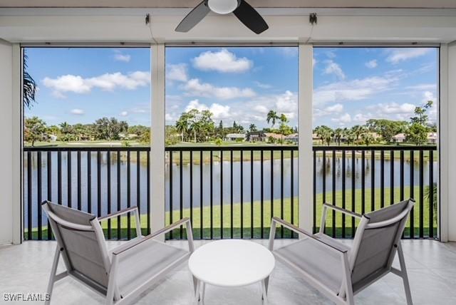 413 Augusta Blvd Unit 205, Naples, FL 34113 - sunroom / solarium with a water view