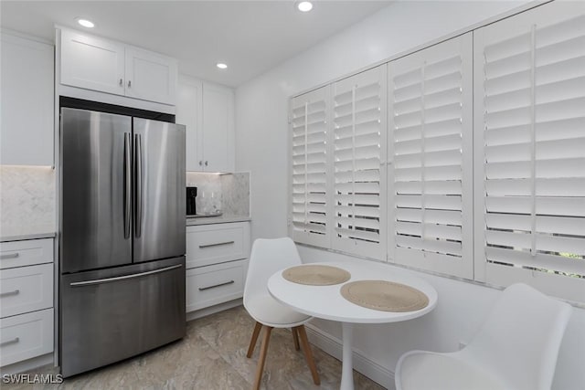 413 Augusta Blvd Unit 205, Naples, FL 34113 - kitchen featuring freestanding refrigerator, white cabinetry, backsplash, recessed lighting, and light countertops