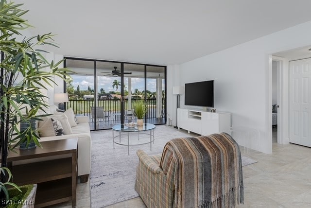 living room featuring floor to ceiling windows