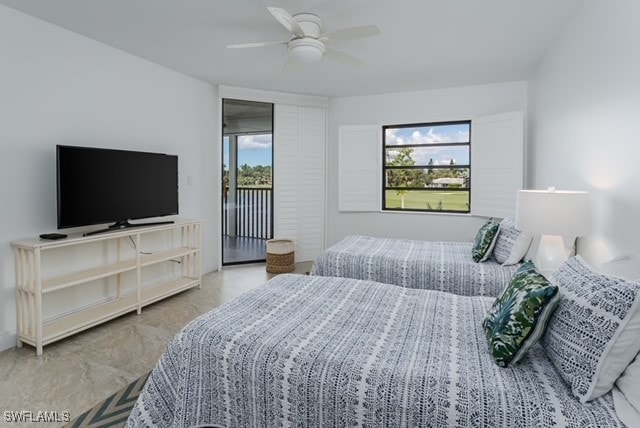 bedroom with access to exterior, multiple windows, and ceiling fan