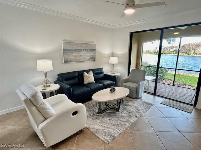 tiled living room featuring a water view, ceiling fan, and crown molding