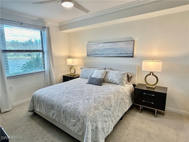 bedroom with light colored carpet, ceiling fan, and crown molding