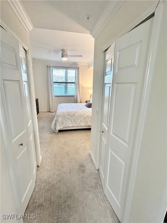 carpeted bedroom featuring ornamental molding