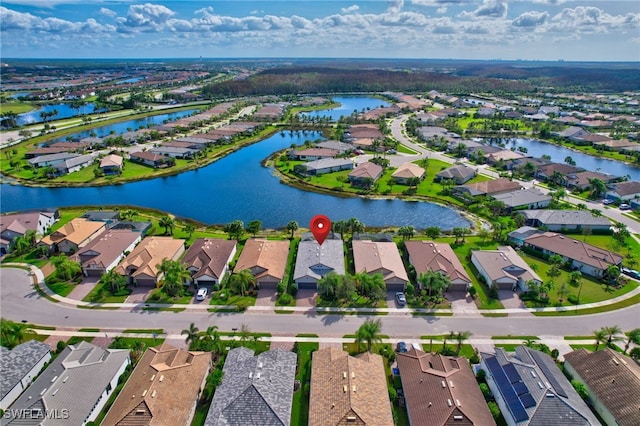 birds eye view of property featuring a water view