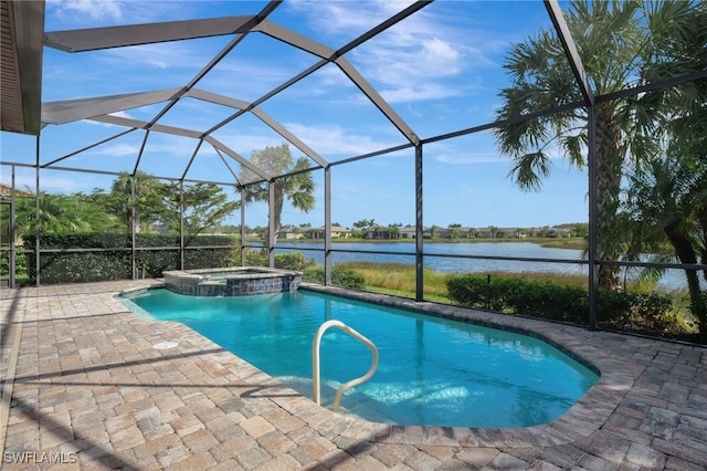 view of pool featuring a patio, glass enclosure, an in ground hot tub, and a water view