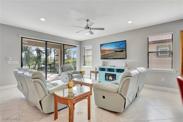 living room with light tile patterned floors and ceiling fan