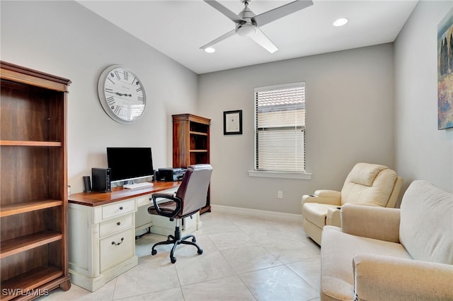 home office featuring light tile patterned floors and ceiling fan