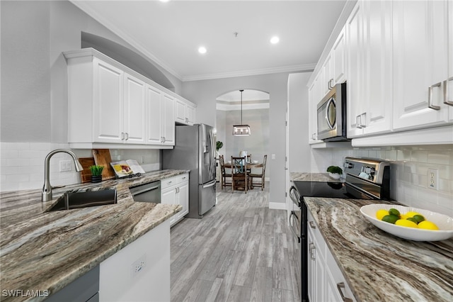 kitchen featuring white cabinetry, appliances with stainless steel finishes, sink, and stone countertops