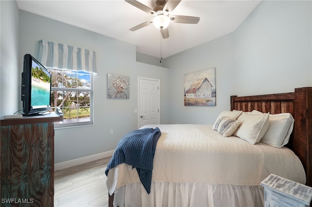 bedroom featuring light hardwood / wood-style flooring and ceiling fan