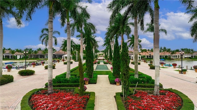 surrounding community featuring a water view