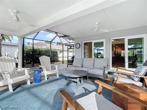 view of patio featuring ceiling fan, a lanai, and an outdoor hangout area