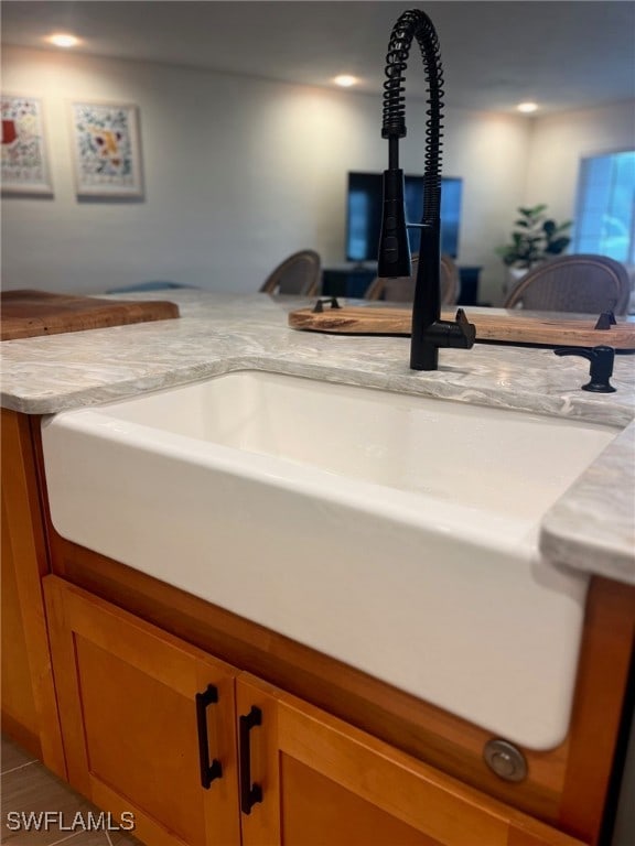 details with tile patterned flooring and sink