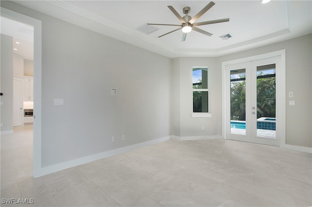 empty room with french doors, ceiling fan, and crown molding