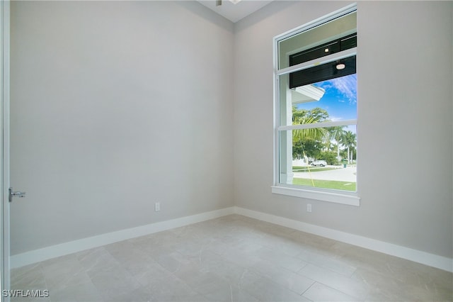 empty room featuring light tile patterned floors