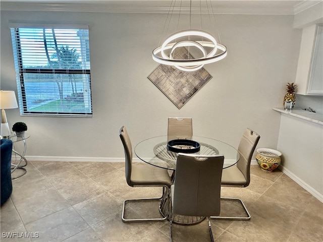 tiled dining space with a chandelier and ornamental molding