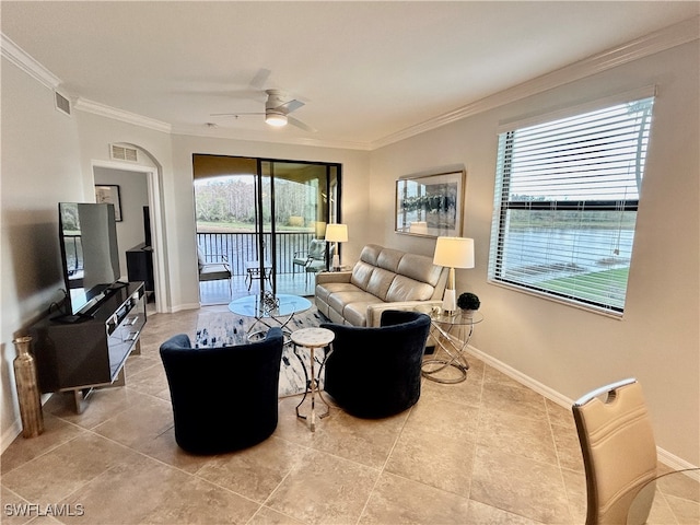 living room with ceiling fan and ornamental molding