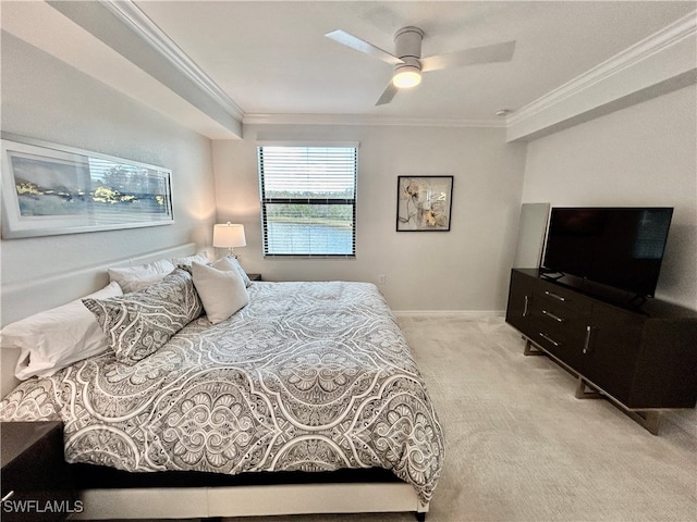 carpeted bedroom with ceiling fan and crown molding