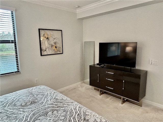 carpeted bedroom featuring ornamental molding