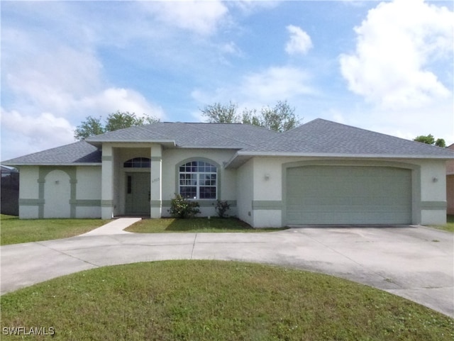 ranch-style house with a garage and a front yard