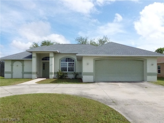 view of front facade with a garage and a front yard