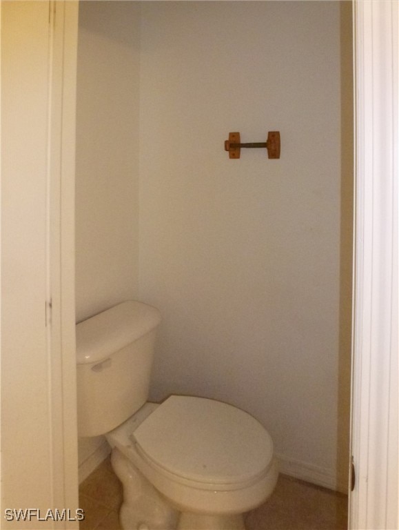 bathroom with tile patterned floors and toilet