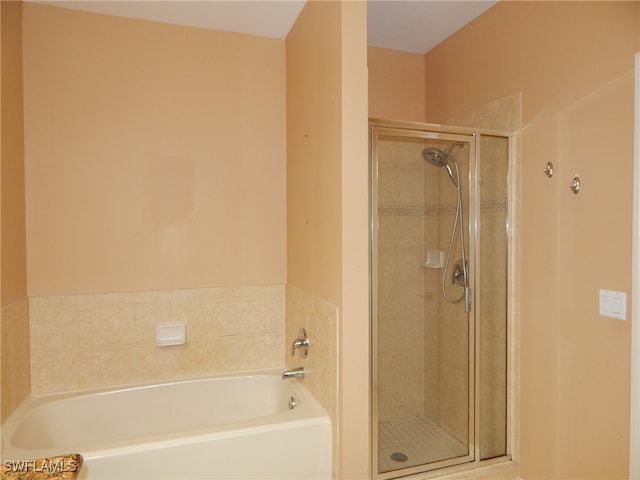 bathroom featuring plus walk in shower