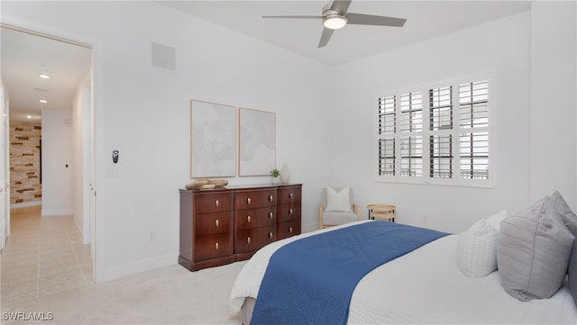 bedroom with light colored carpet and ceiling fan