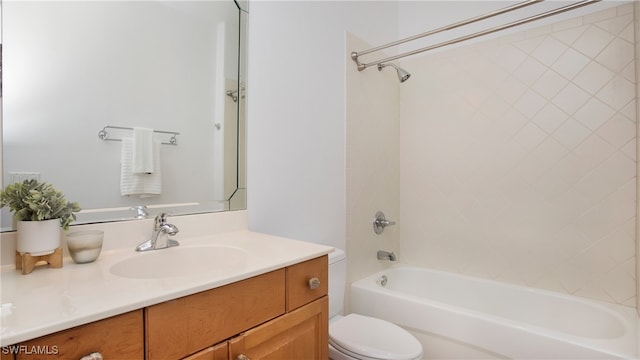 full bathroom featuring toilet, vanity, and tiled shower / bath