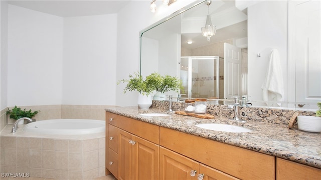 bathroom with independent shower and bath and vanity