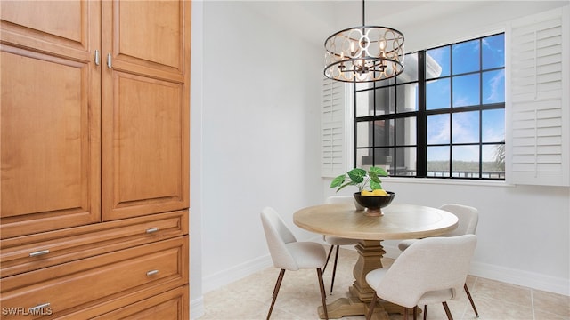 tiled dining room with plenty of natural light and a chandelier