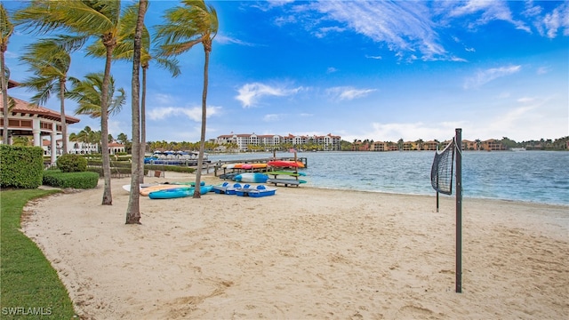 view of property's community featuring a beach view and a water view