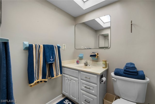 bathroom with toilet and vanity