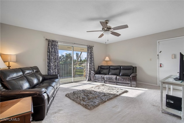 living room featuring ceiling fan and carpet flooring