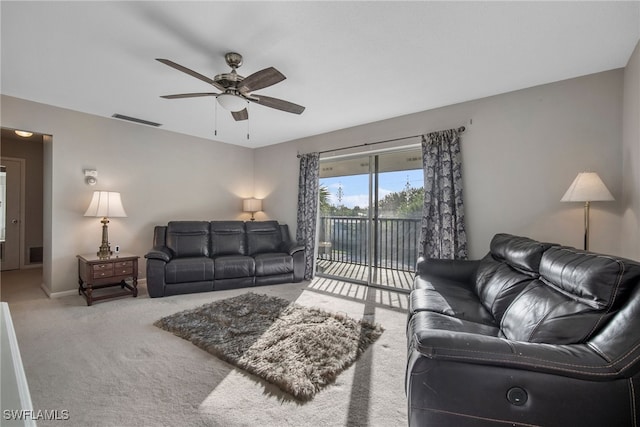 living room featuring carpet floors and ceiling fan