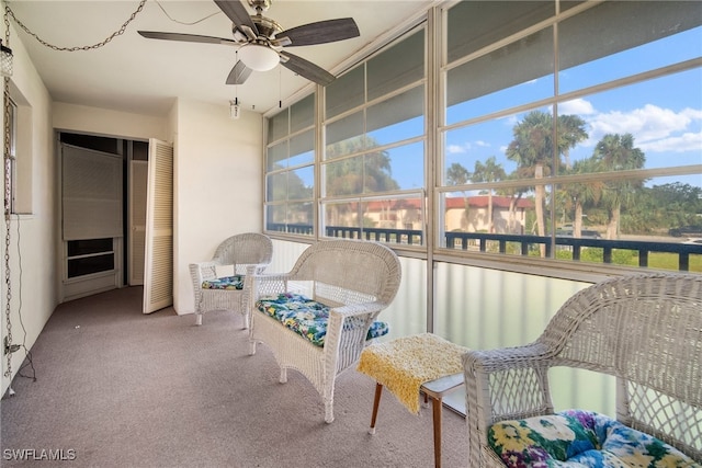 sunroom featuring ceiling fan