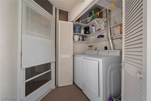 washroom featuring separate washer and dryer and carpet flooring