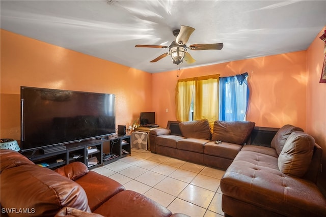 tiled living room with ceiling fan