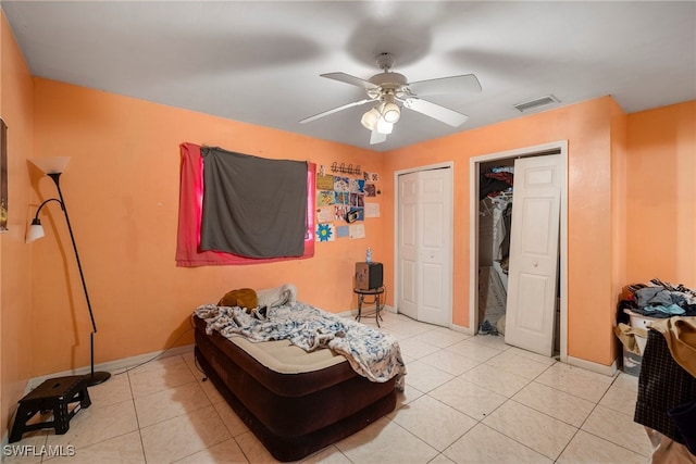 bedroom featuring light tile patterned flooring and ceiling fan